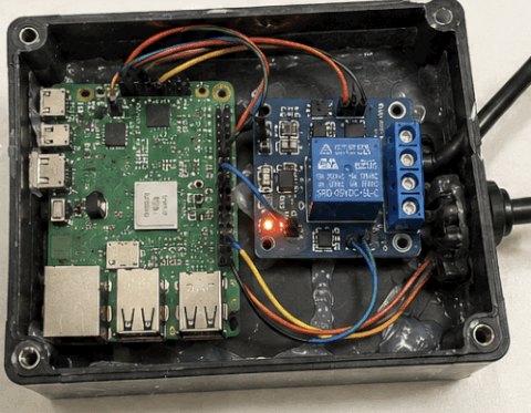 Pi and relay inside the sealed enclosure.